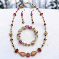 Winter Bloom Jewelry Set – champagne pearls, magenta crystals, and gold filigree teardrops