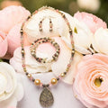 Rose Garden Tree of Life Jewelry Set with champagne pearls, rose quartz and silver tree of life teardrop pendant, photographed with pink and white roses