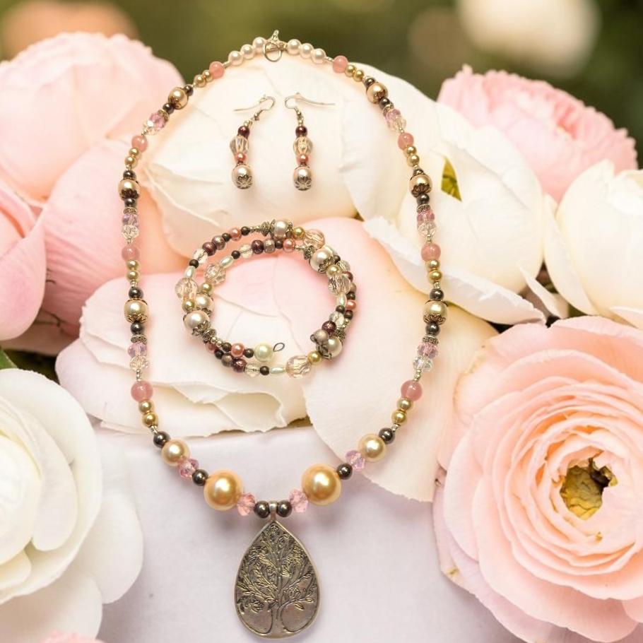 Rose Garden Tree of Life Jewelry Set with champagne pearls, rose quartz and silver tree of life teardrop pendant, photographed with pink and white roses